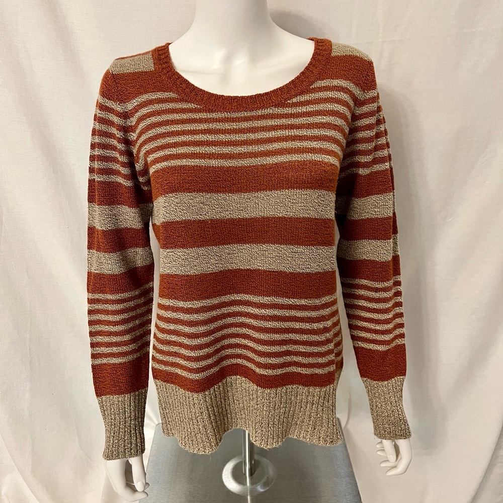 Women's crew neck sweater in orange and tan.